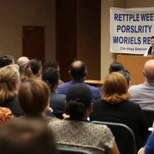 Community members discussing rental aid cuts in San Diego