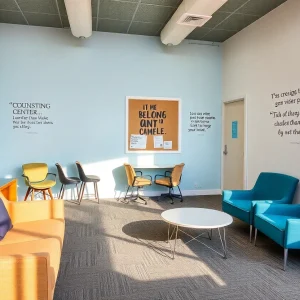 Interior of a drop-in center designed for sex-trafficked teens with seating and counseling areas.