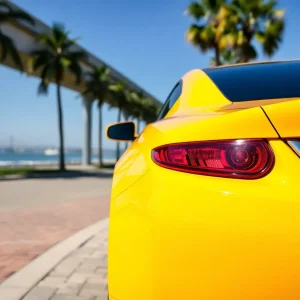 A bright yellow car against a San Diego backdrop