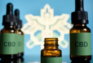CBD oil bottles with medical symbols representing the Medicare and Medicaid Pilot Program.
