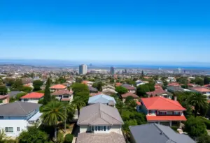 View of San Diego homes with price signs showing declines.