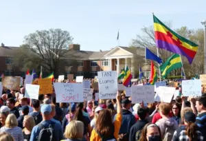 Community members protesting against ICE activities near schools in San Diego.