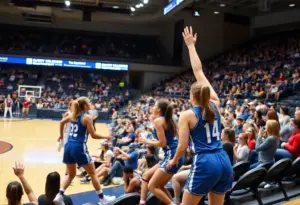 Women's college basketball game with players from SDSU and UCSD in action.